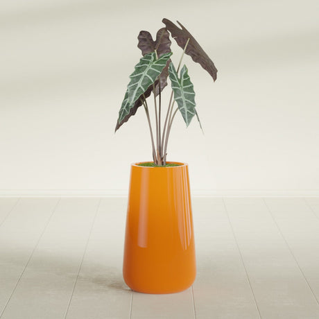 Saigon Tapered Round fiberglass planter in Gloss Tangerine, shown planted, in a sunlit interior