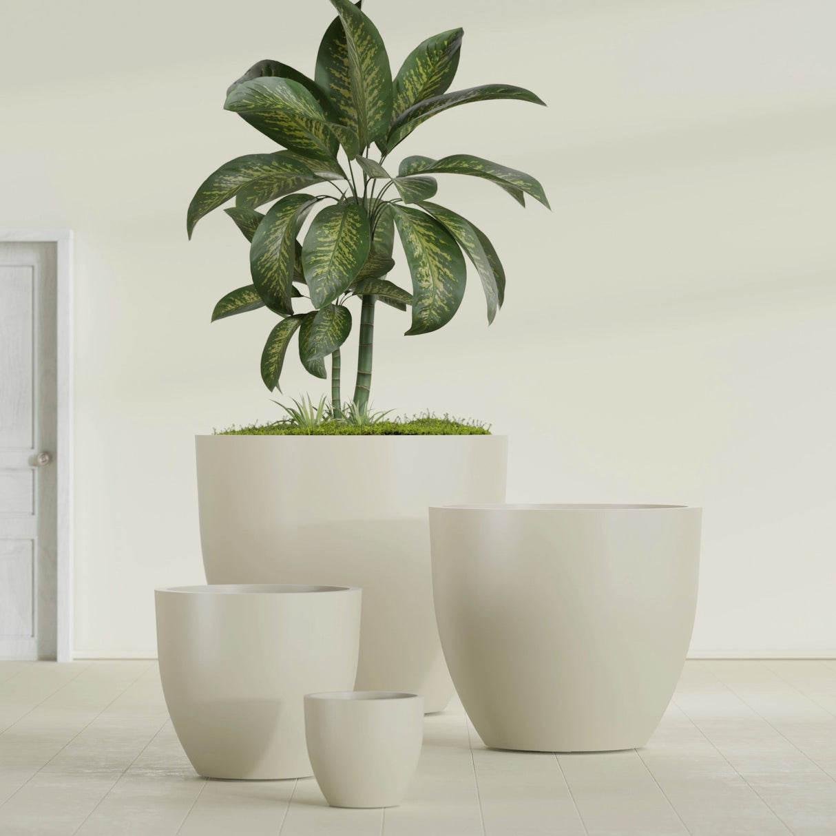 Wannsee Round fiberglass planter in Satin Beige, size range, in a sunlit interior