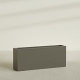 Hollywood Narrow Rectangular Planter in Matte Bronze, 60"L × 12"D × 24"H, shown empty