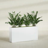 Milano Narrow fiberglass planter in Gloss Bright White, planted, in a sunlit interior