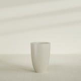 Brannan Tapered Round Planter in Satin Beige, 24"D × 35"H, shown empty
