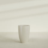 Brannan Tapered Round Planter in Satin Beige, 24"D × 35"H, shown empty