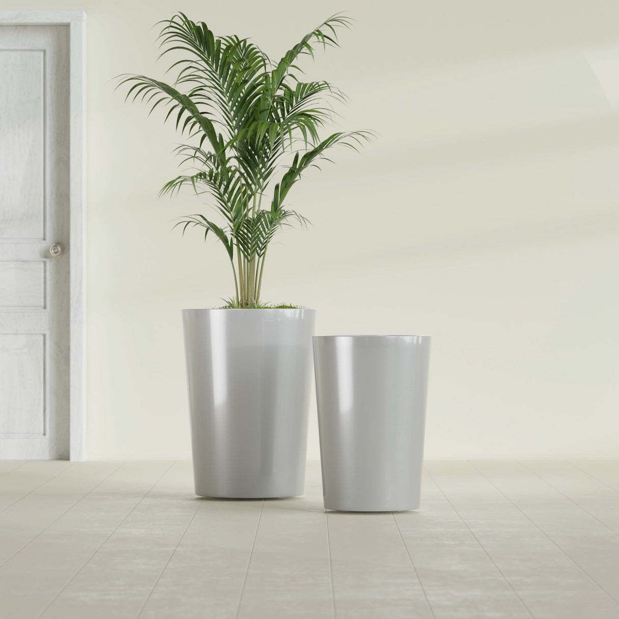 Tegel Round Tapered fiberglass planter in Metallic Silver, size range, in a sunlit interior
