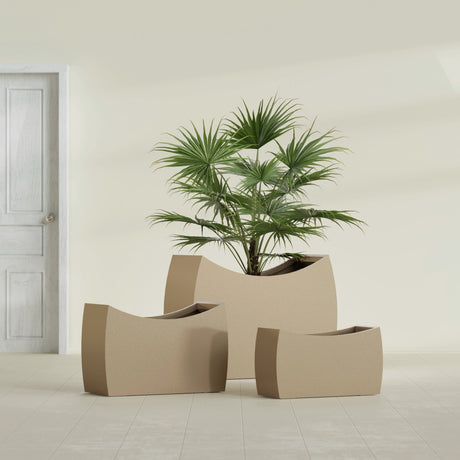 Seoul Curved fiberglass planter in Gloss Metallic Gold, size range, in a sunlit interior