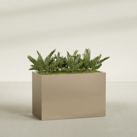 Brisbane Corner fiberglass planter in Gloss Metallic Gold, shown planted, in a sunlit interior