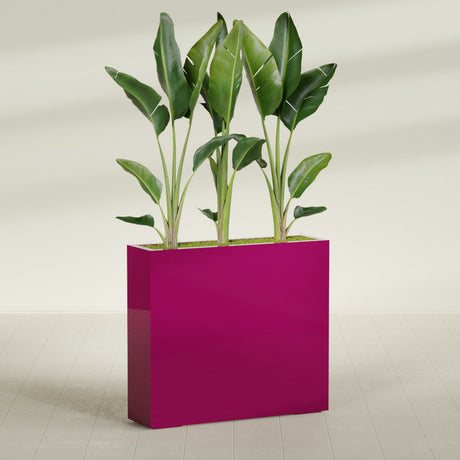 Amesbury Narrow Rectangular fiberglass planter in Gloss Eggplant, shown planted, in a sunlit interior