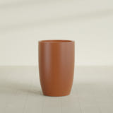 Lisbon tall round tapered fiberglass planter in Matte Terra Cotta, 24 in diameter, 36 in high, shown empty