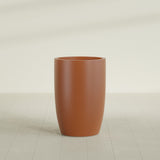 Lisbon tall round tapered fiberglass planter in Matte Terra Cotta, 24 in diameter, 36 in high, shown empty