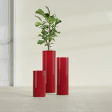 Corry Cylinder fiberglass planter in Gloss Red, size range, in a sunlit interior