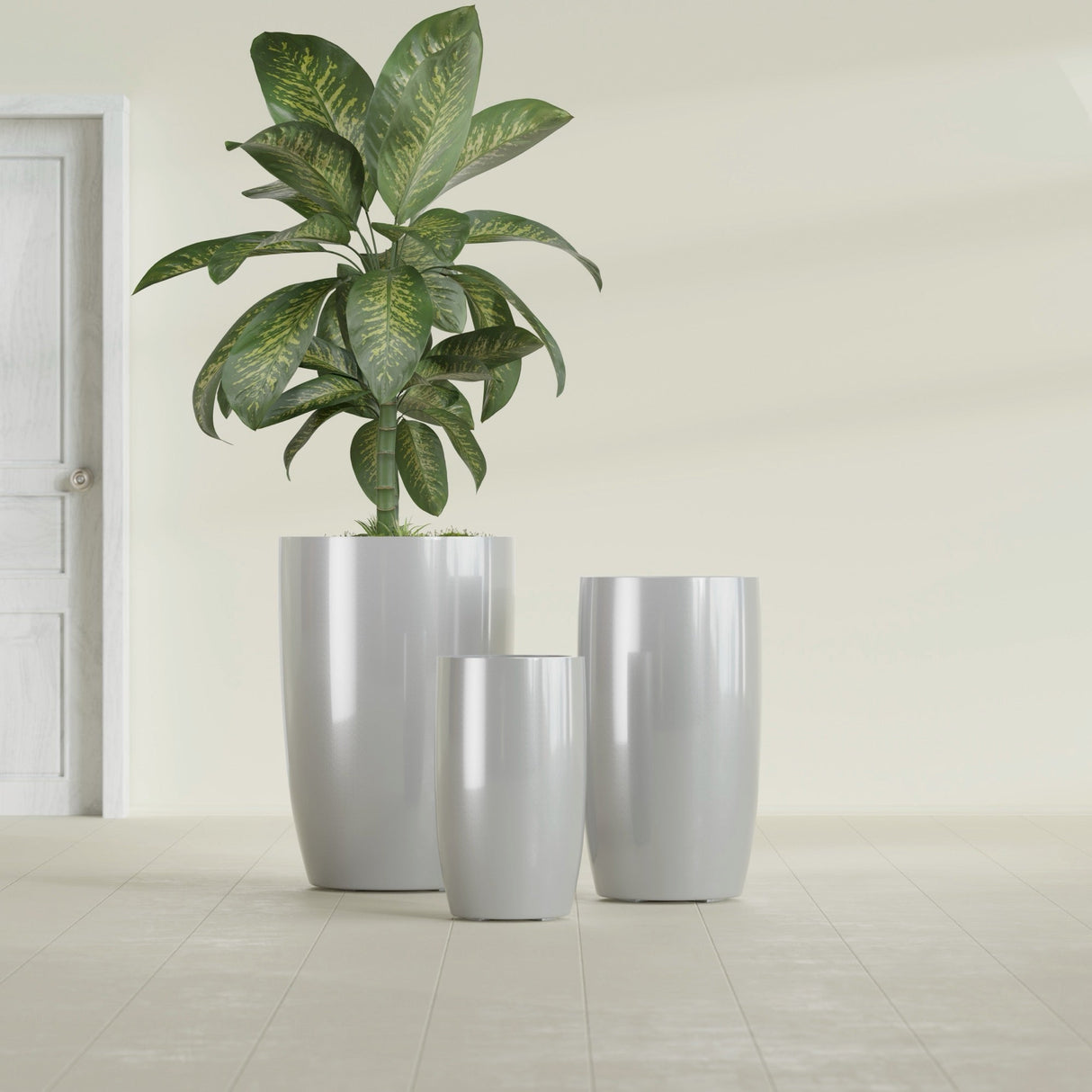 Lisbon Tall Round fiberglass planter in Metallic Silver, size range, in a sunlit interior