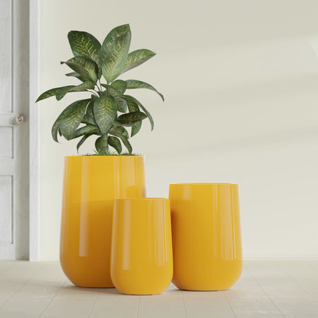Hayden Urn fiberglass planter in Gloss Saffron, size range, in a sunlit interior