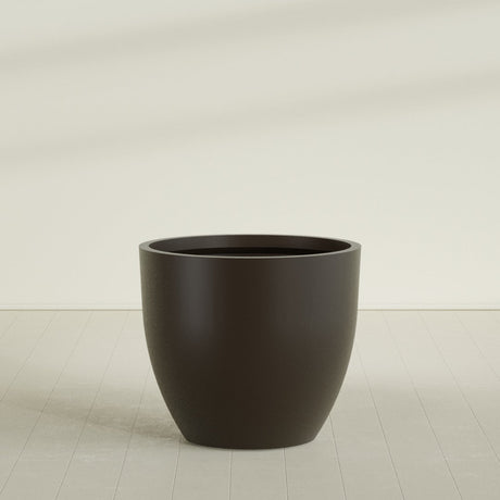Wannsee Round Planter in Matte Dark Brown, 50"D × 44"H, shown empty