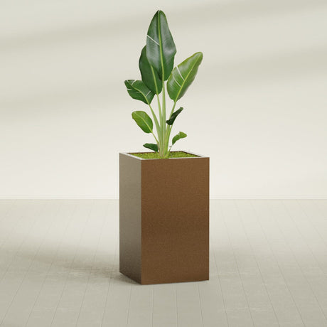 Darwin Corner fiberglass planter in Metallic Bronze, shown planted, in a sunlit interior