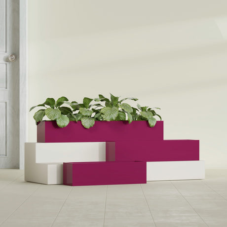 Monaco Rectangle fiberglass planter in Gloss Eggplant, shown planted, in a sunlit interior