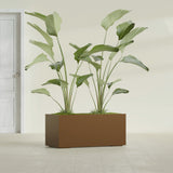 Badalona Rectangular fiberglass planter in Metallic Bronze, shown planted, in a sunlit interior