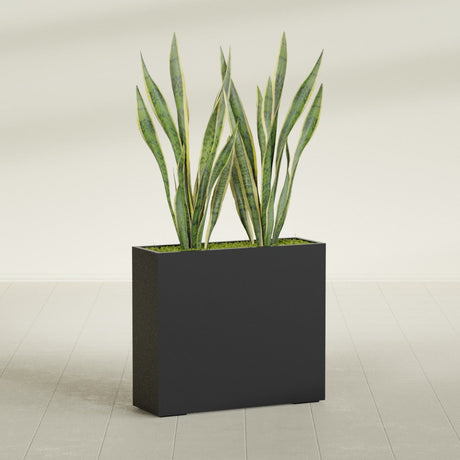 Perth Corner fiberglass planter in Matte Black, shown planted, in a sunlit interior