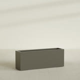 Miami Narrow Rectangular Planter in Matte Bronze, 48"L × 12"D × 18"H, shown empty