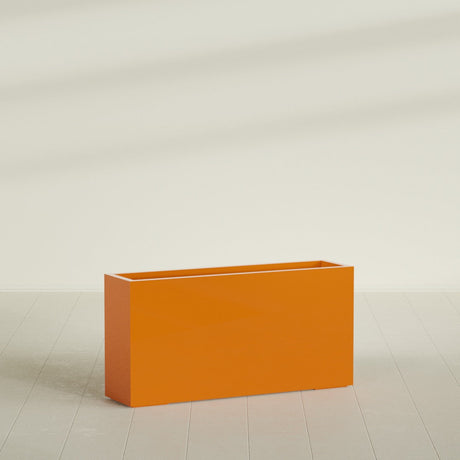 Hollywood Narrow Rectangular Planter in Gloss Tangerine, 48"L × 12"D × 24"H, shown empty