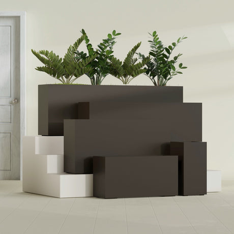 Hollywood Corner fiberglass planter in Matte Dark Brown, size range, in a sunlit interior