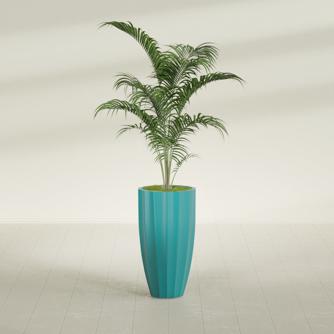 San Jose Tall Fluted fiberglass planter in Satin Seafoam Green, shown planted, in a sunlit interior