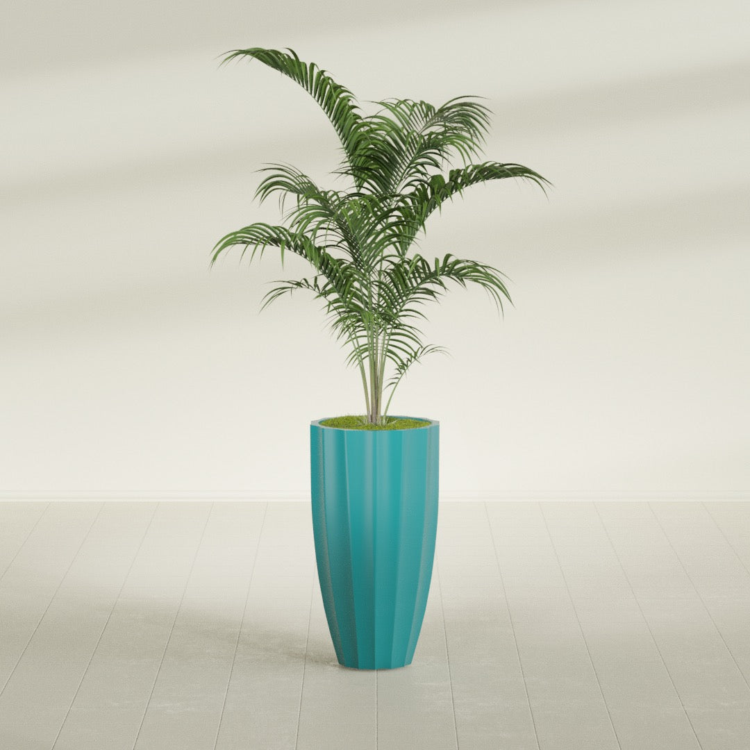 San Jose Tall Fluted fiberglass planter in Satin Seafoam Green, shown planted, in a sunlit interior