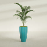 San Jose Tall Fluted fiberglass planter in Satin Seafoam Green, shown planted, in a sunlit interior