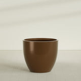 Wannsee Round Planter in Metallic Bronze, 50"D × 44"H, shown empty