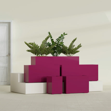 Tolga Corner fiberglass planter in Gloss Eggplant, size range, in a sunlit interior