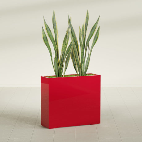 Perth Rectangular fiberglass planter in Gloss Red, shown planted, in a sunlit interior