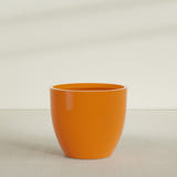 Wannsee Round Planter in Gloss Tangerine, 50"D × 44"H, shown empty