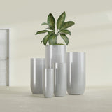 Saint Tropez Bullet Round fiberglass planter in Metallic Silver, size range, in a sunlit interior