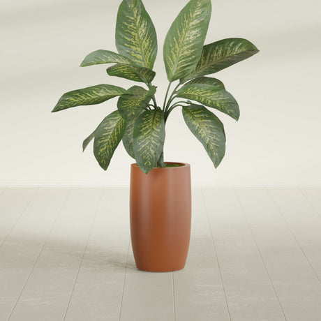 Lisbon Tall Round fiberglass planter in Matte Terra Cotta, shown planted, in a sunlit interior