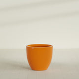 Wannsee Round Planter in Gloss Tangerine, 39"D × 34"H, shown empty
