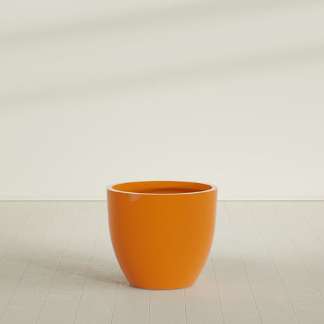 Wannsee Round Planter in Gloss Tangerine, 39"D × 34"H, shown empty
