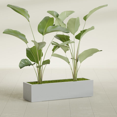 Cuba Corner fiberglass planter in Metallic Silver, shown planted, in a sunlit interior
