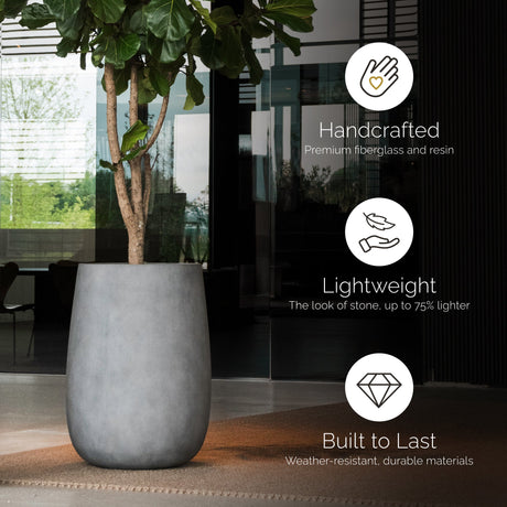 Mondo High tall round Cosapots fiberglass planter, shown planted in a styled setting.