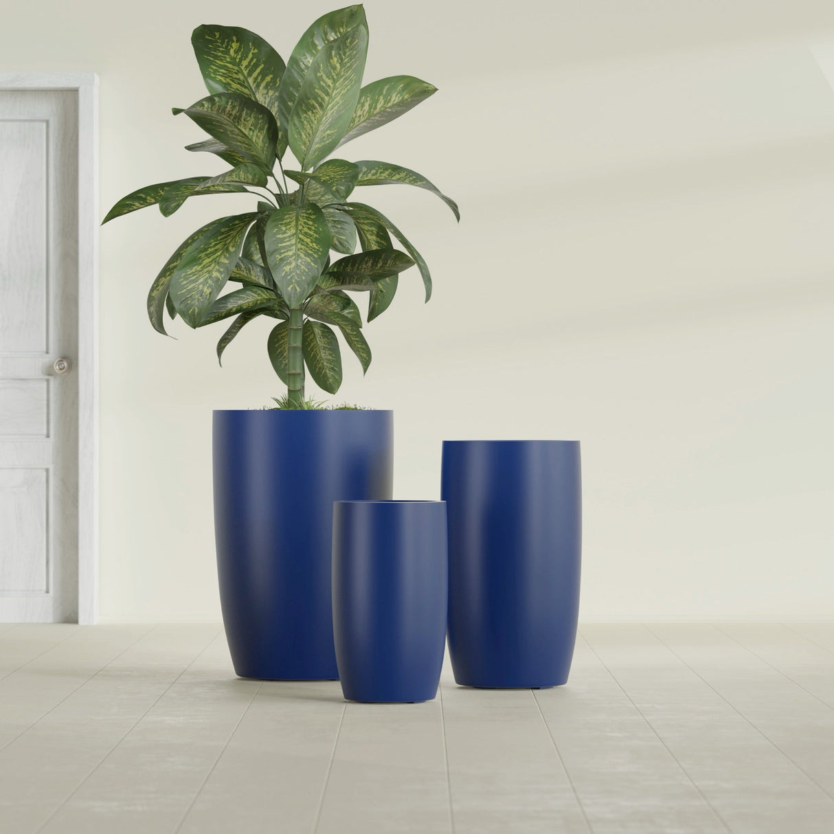 Lisbon Tall Round fiberglass planter in Matte Cobalt Blue, size range, in a sunlit interior