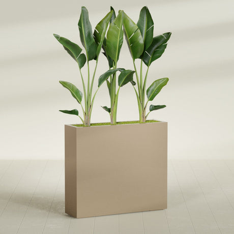 Amesbury Narrow Rectangular fiberglass planter in Gloss Metallic Gold, shown planted, in a sunlit interior