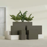 Potsdam Rectangular fiberglass planter in Matte Bronze, size range, in a sunlit interior