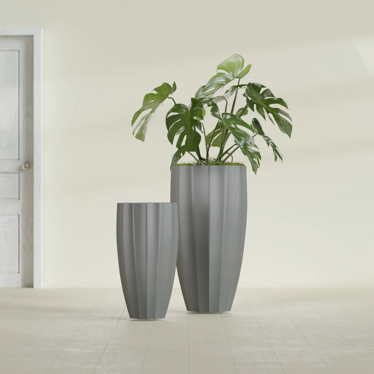 San Jose Tall Fluted fiberglass planter in Matte Gunmetal, size range, in a sunlit interior
