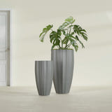 San Jose Tall Fluted fiberglass planter in Matte Gunmetal, size range, in a sunlit interior