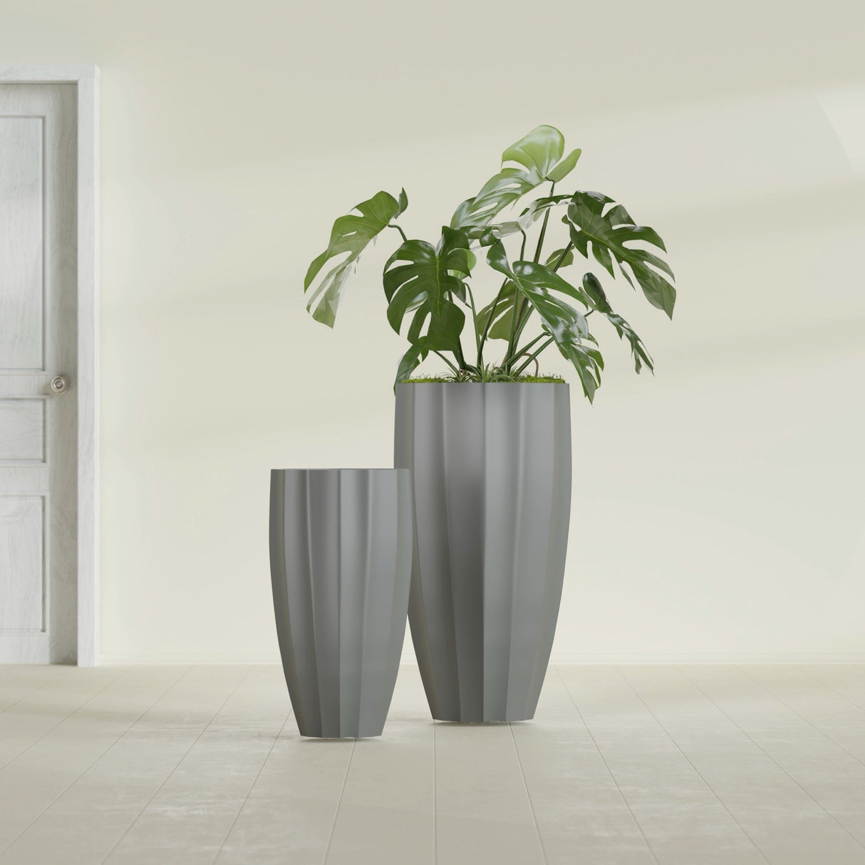 San Jose Tall Fluted fiberglass planter in Matte Gunmetal, size range, in a sunlit interior