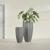 San Jose Tall Fluted fiberglass planter in Matte Gunmetal, size range, in a sunlit interior