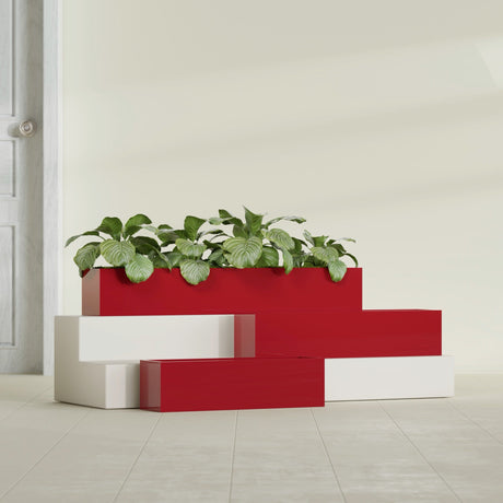 Monaco Rectangle fiberglass planter in Gloss Red, shown planted, in a sunlit interior