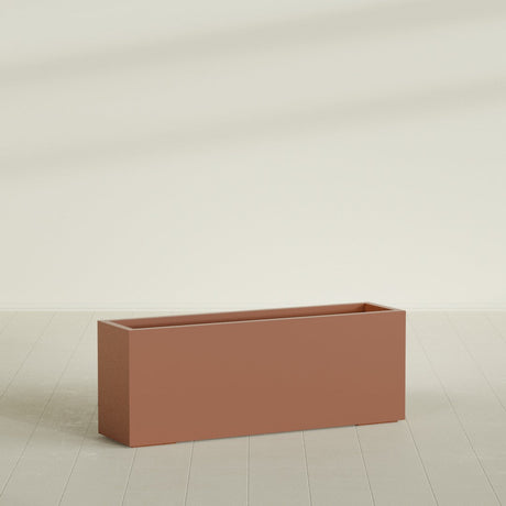 Miami Narrow Rectangular Planter in Matte Terra Cotta, 48"L × 12"D × 18"H, shown empty
