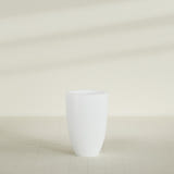 Brannan Tapered Round Planter in Matte Bright White, 24"D × 35"H, shown empty