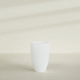 Brannan Tapered Round Planter in Matte Bright White, 24"D × 35"H, shown empty