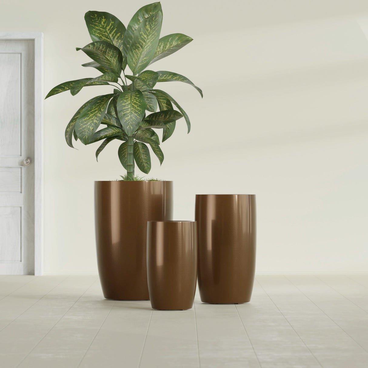 Lisbon Tall Round fiberglass planter in Metallic Bronze, size range, in a sunlit interior