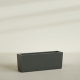 Panama Tapered Rectangular Planter in Matte Charcoal, 48"L × 12"D × 18"H, shown empty