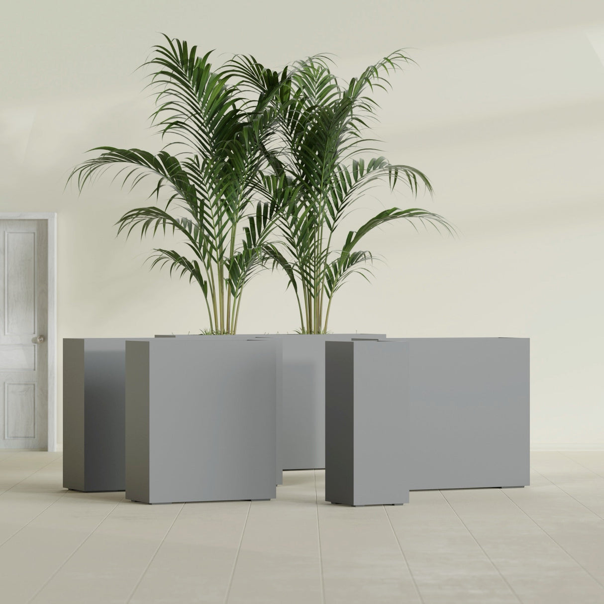 Perth Corner fiberglass planter in Matte Gunmetal, size range, in a sunlit interior